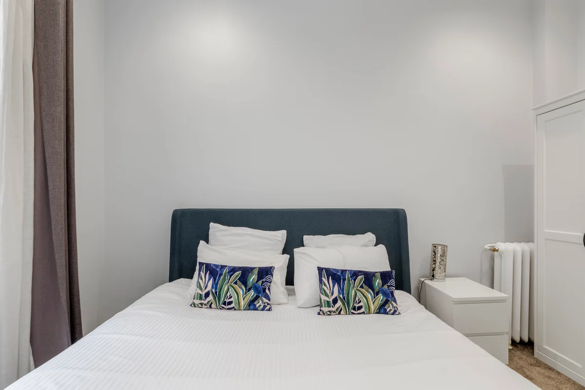 	Third guest bedroom at Casa Cribs featuring sophisticated decor and ample storage.