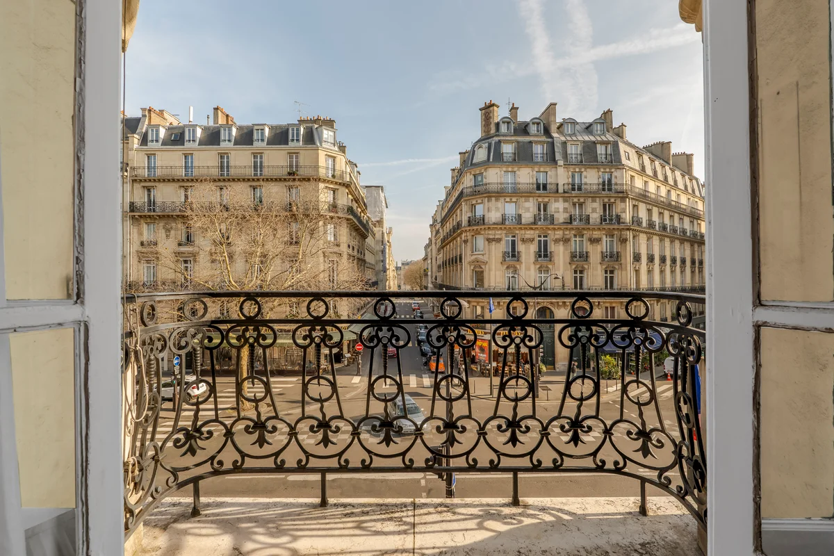 Stunning view of Paris from the private balcony at Casa Cribs, offering a classic cityscape.