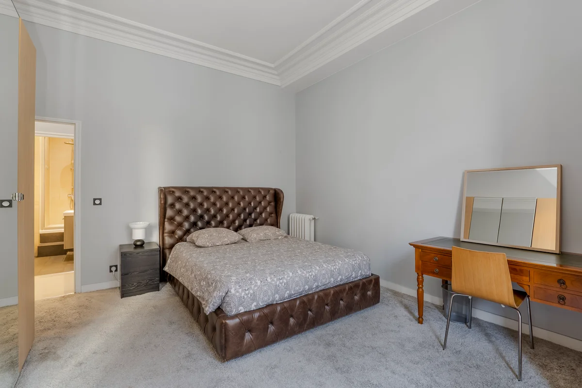 	Additional bedroom at Casa Cribs showcasing timeless Parisian style and comfort.