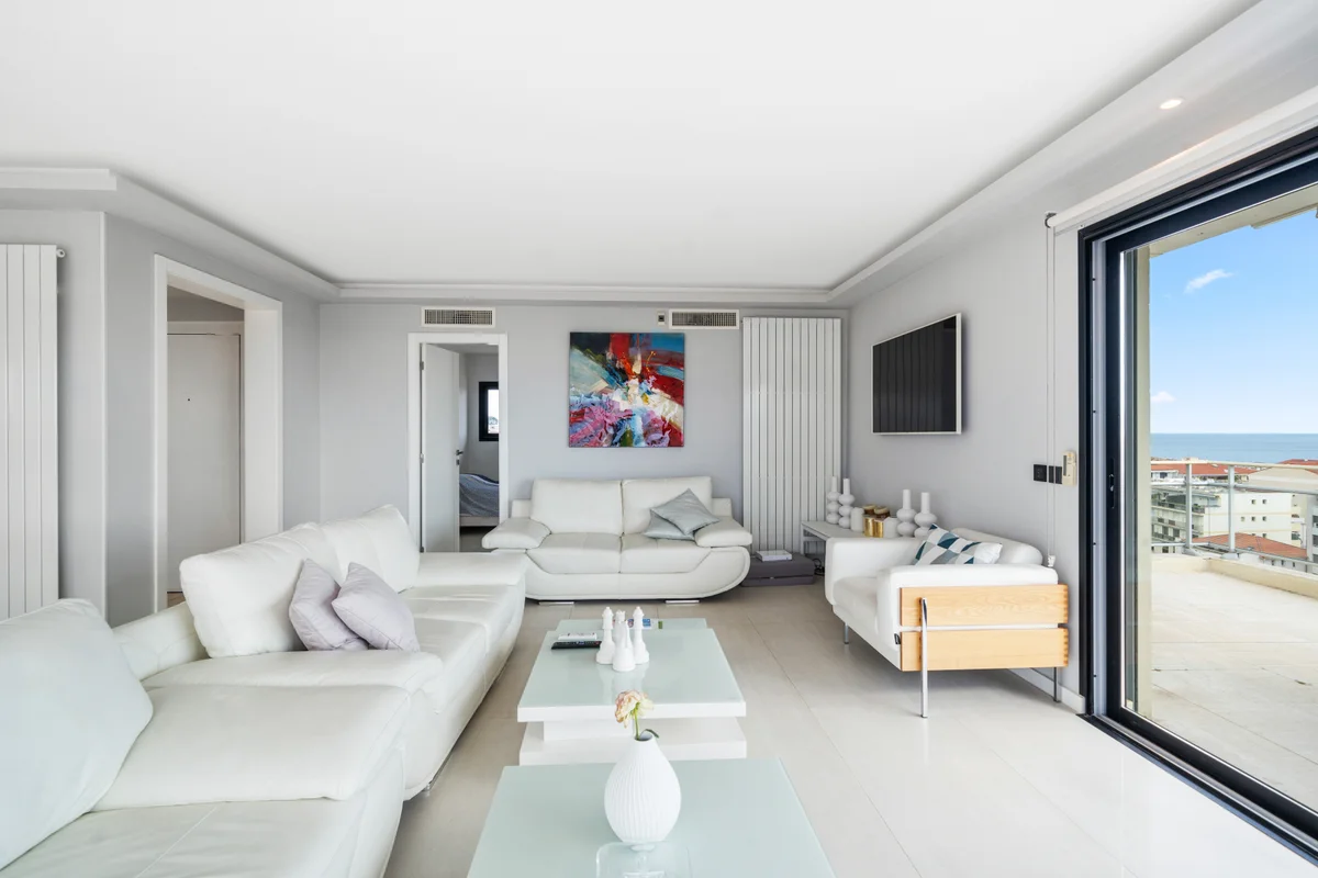 Sophisticated living room at Casa Cribs with designer furnishings and panoramic views of Cannes.