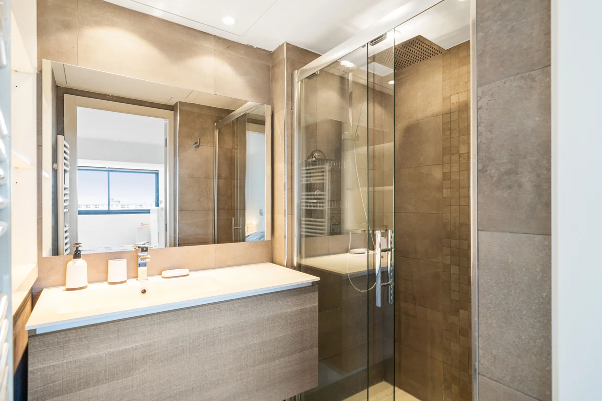 Second view of the modern bathroom at Casa Cribs with premium fixtures and refined elegance.