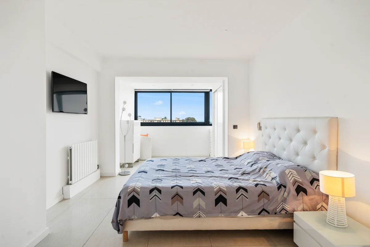 Second bedroom at Casa Cribs featuring a king-sized bed and ample natural light.