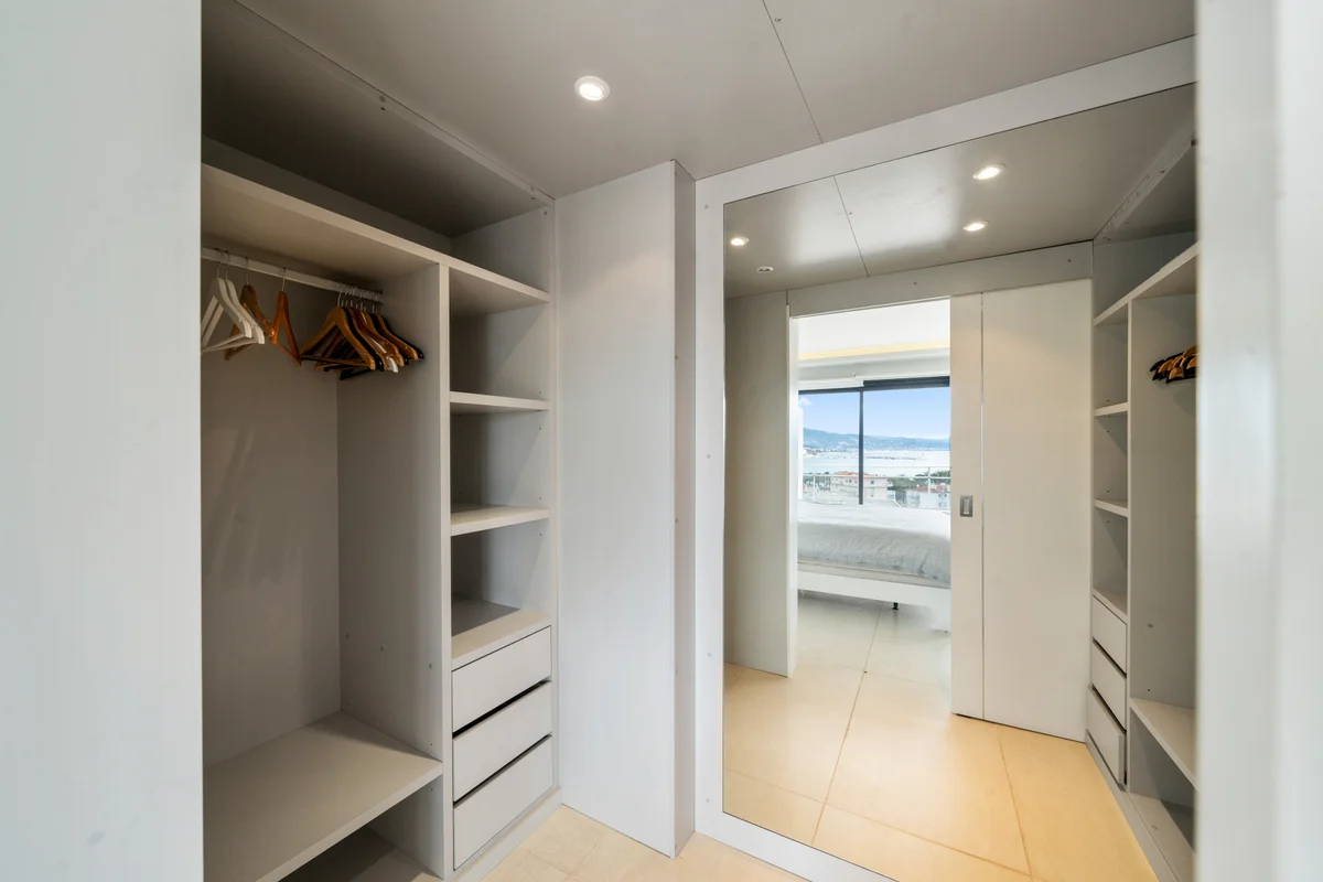 	Spacious walk-in dressing room at Casa Cribs providing elegant storage solutions.