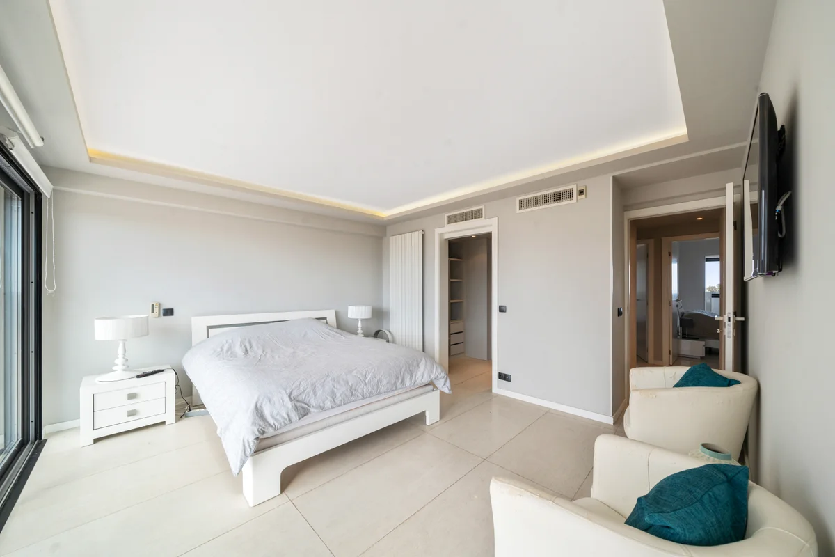 	Third angle of the bedroom at Casa Cribs highlighting natural light and sophisticated decor.