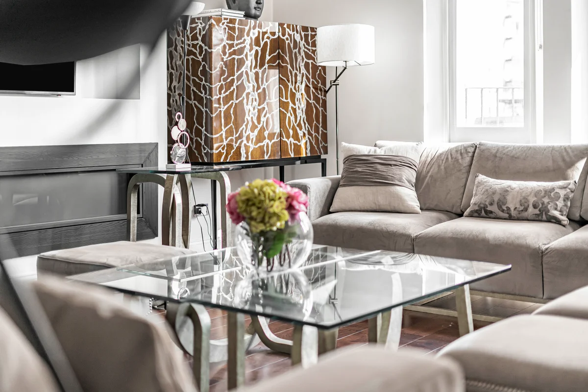 Stylish glass coffee table in the living room at Casa Cribs enhancing the elegant decor.