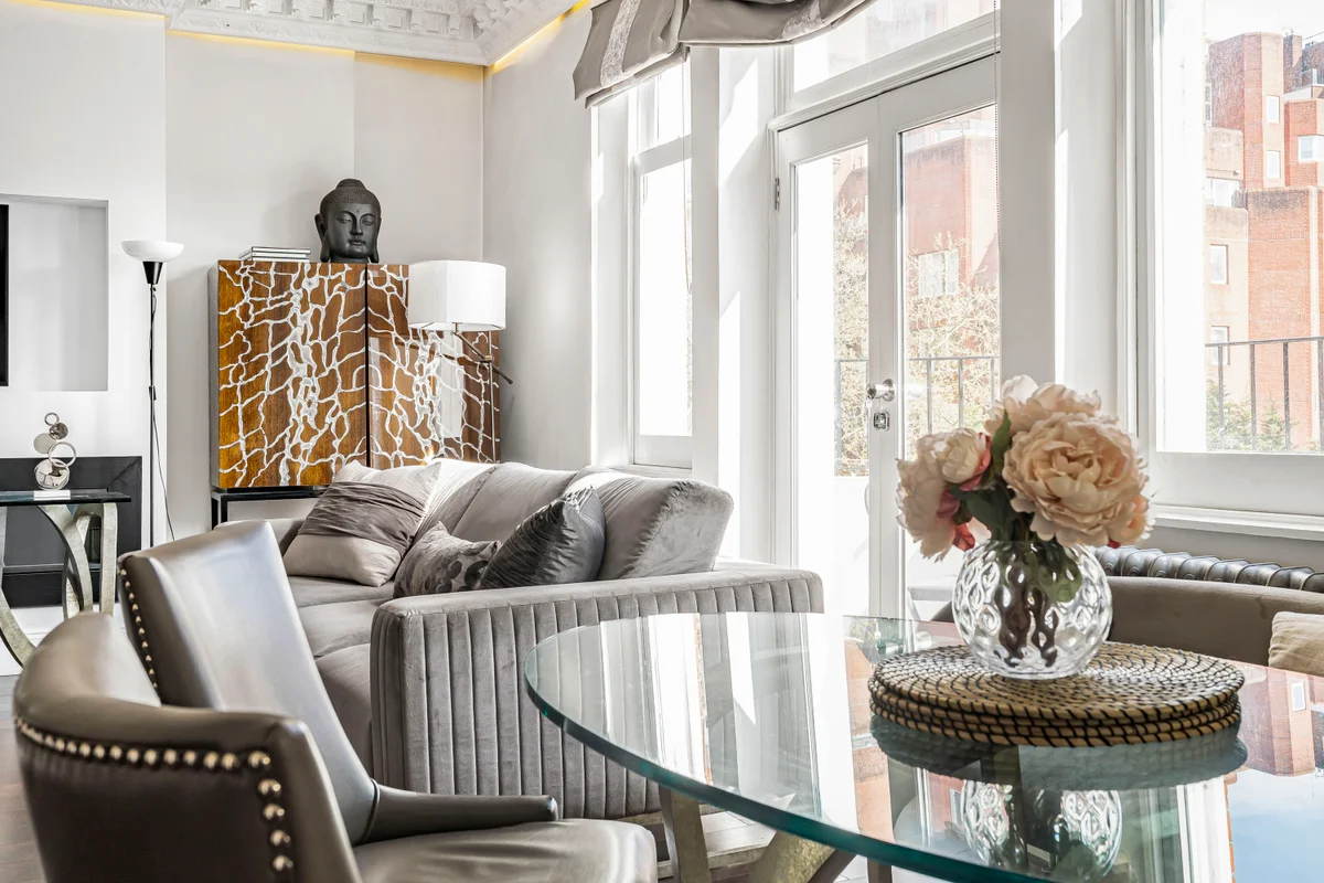 Glass dining table with modern chairs at Casa Cribs creating an elegant dining experience.