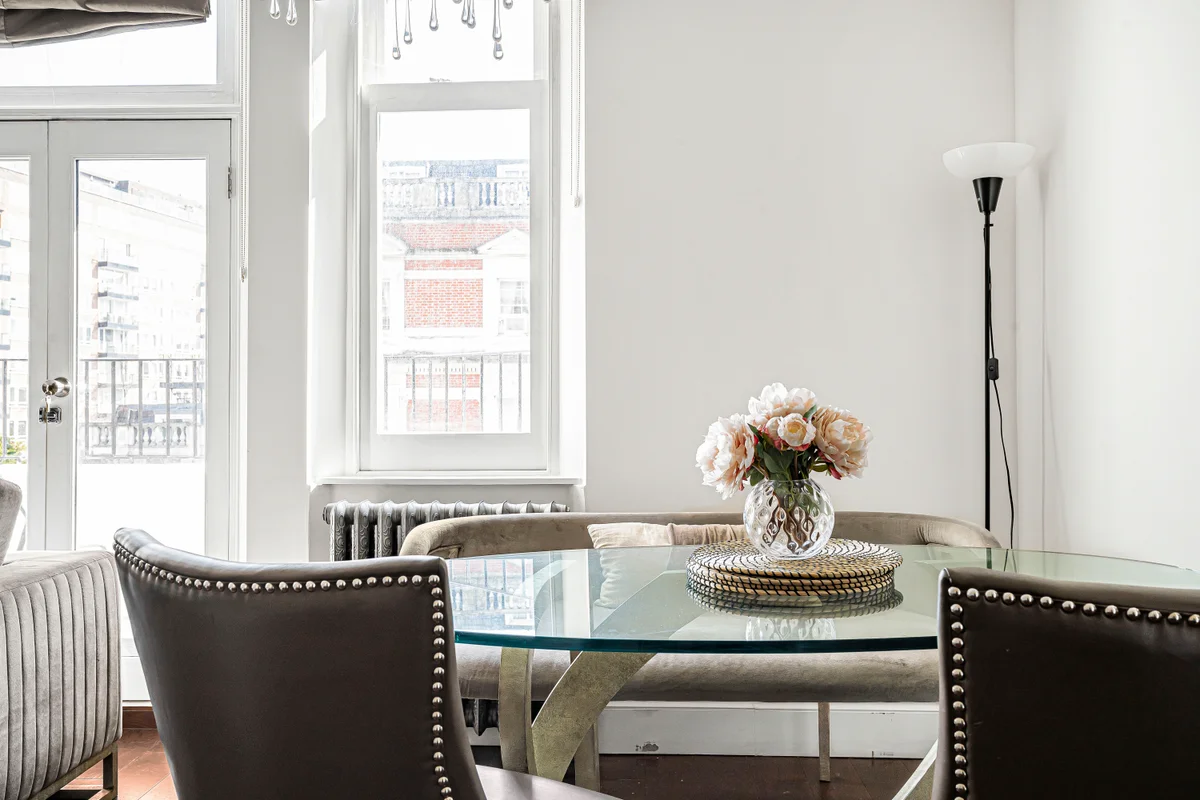 Another view of the sleek glass dining table and contemporary chairs at Casa Cribs.