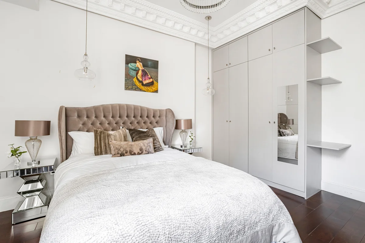 	Spacious bedroom at Casa Cribs featuring a king-sized bed and elegant decor.