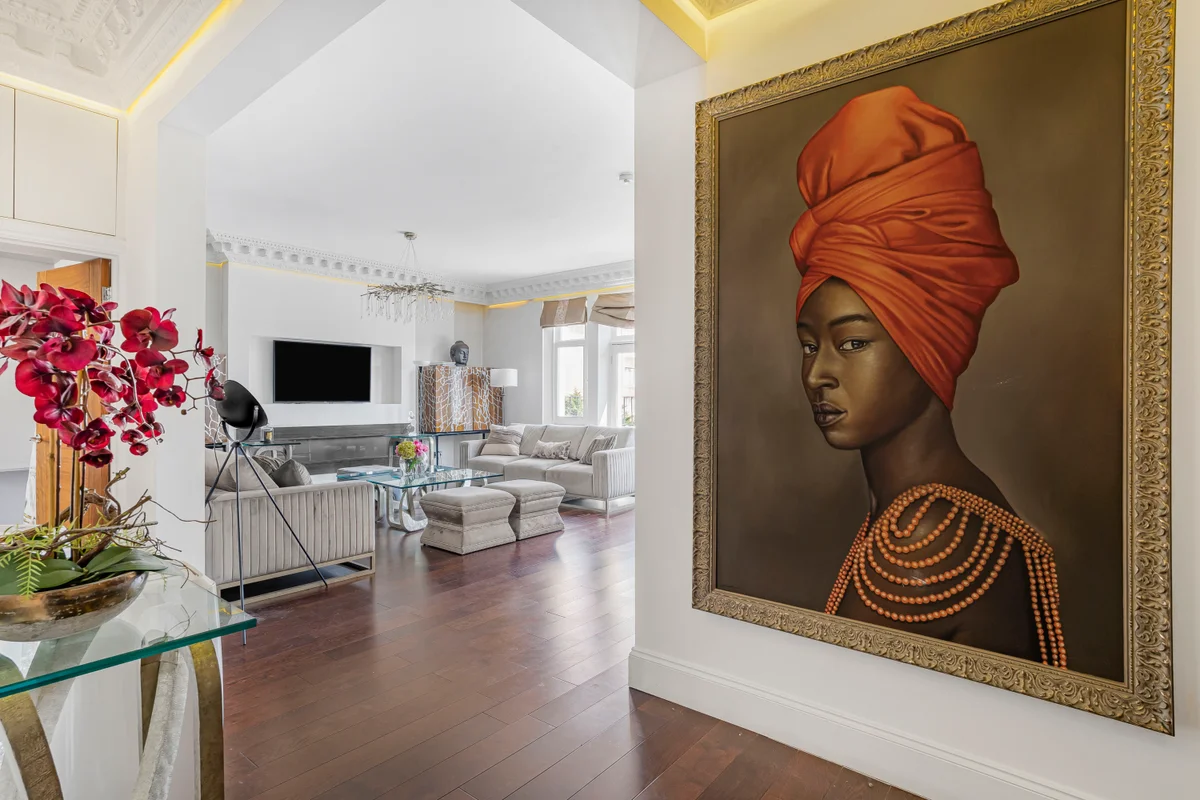 Artistic portrait of a woman adding character to the elegant living space at Casa Cribs.