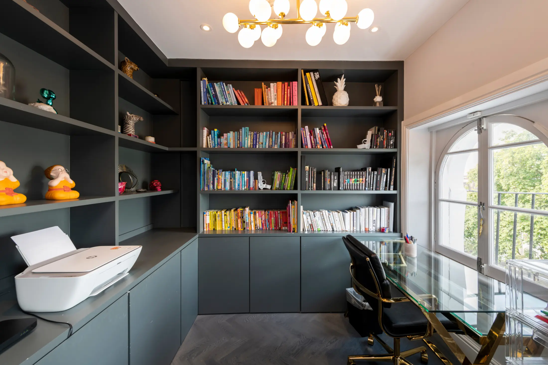 Stylish library corner at Casa Cribs with curated books and elegant design.