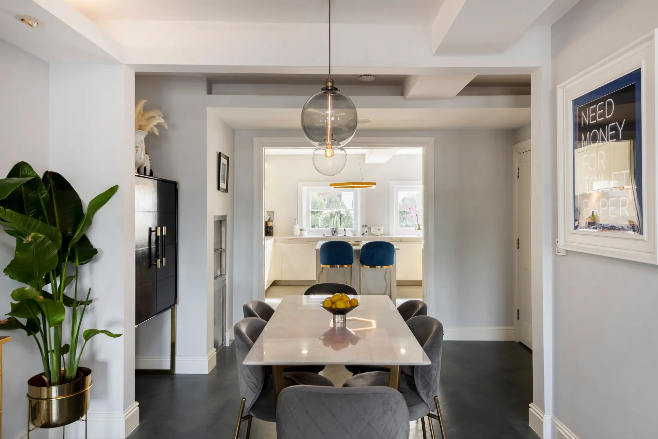 Elegant dining table with modern chairs at Casa Cribs, perfect for shared meals.