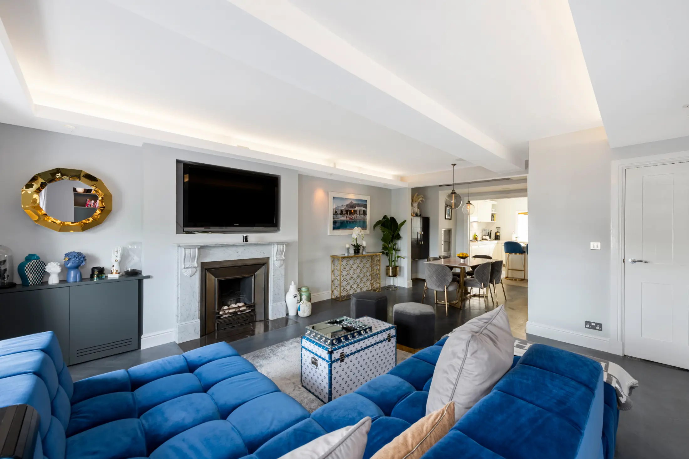 Bright living room at Casa Cribs with plush seating and sophisticated decor.