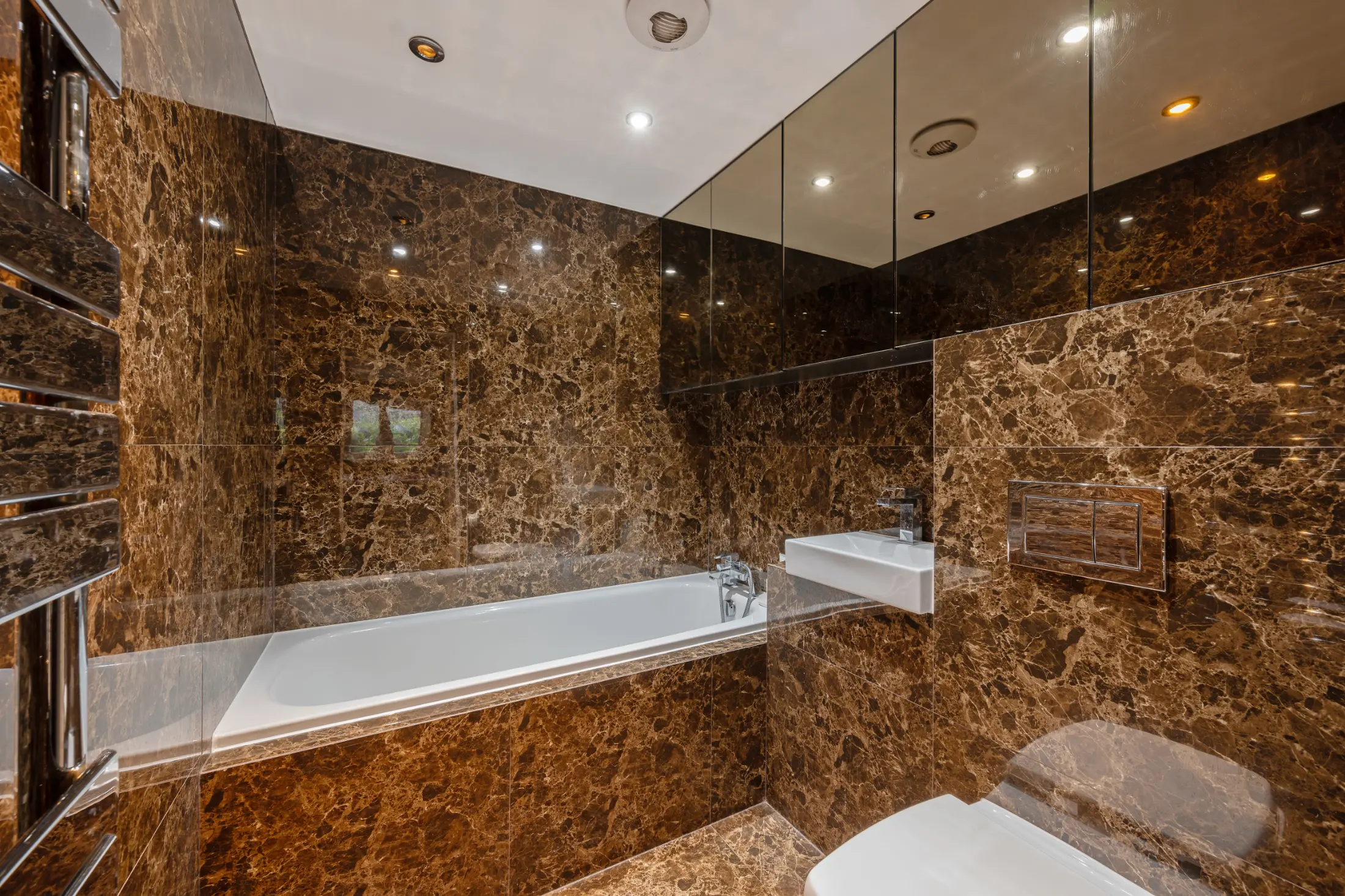 Luxurious bathroom at Casa Cribs featuring a marble bathtub and a spa-like retreat.