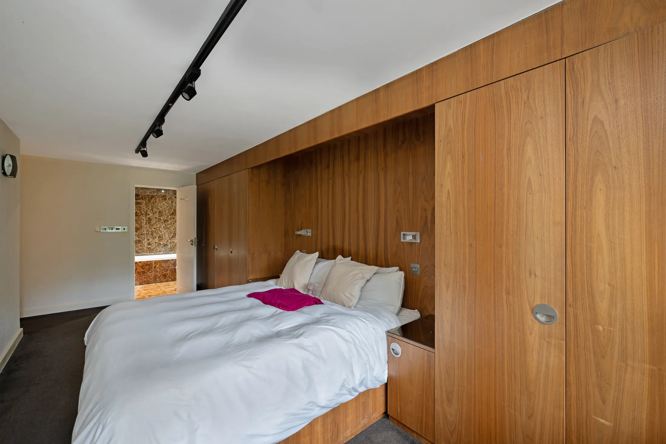 Another view of the elegant living space at Casa Cribs with plush seating and modern lighting.