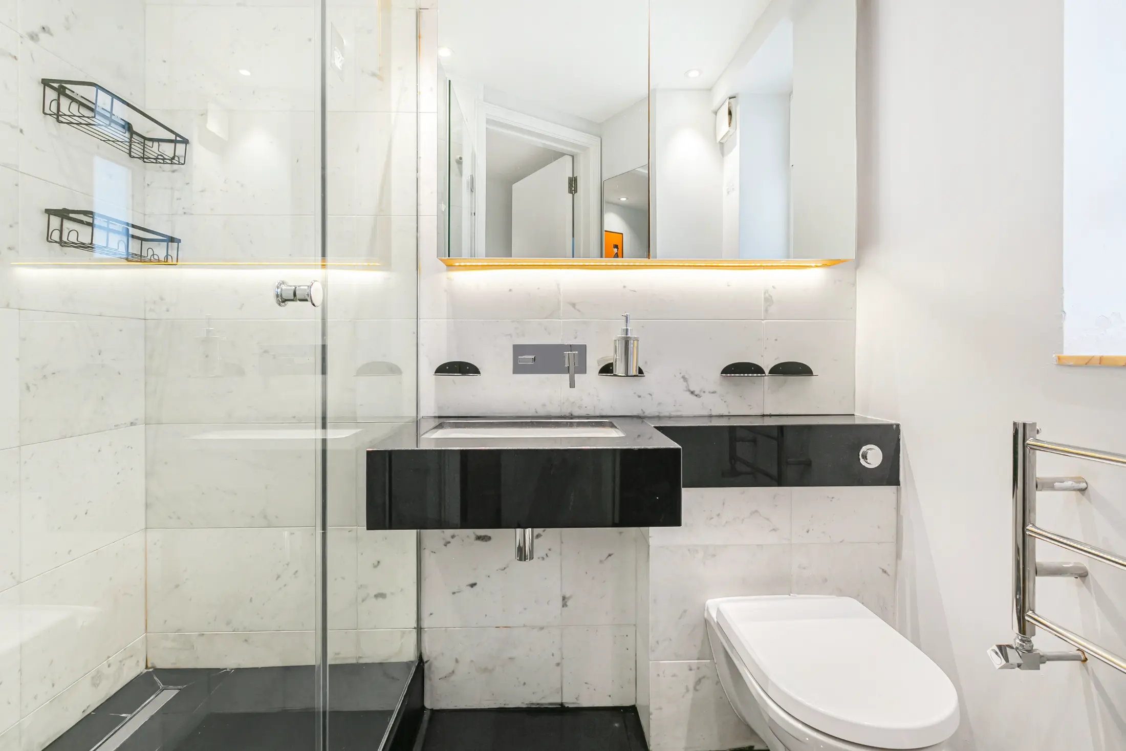 Modern marble bathroom at Casa Cribs featuring a rainfall shower and luxurious finishes.