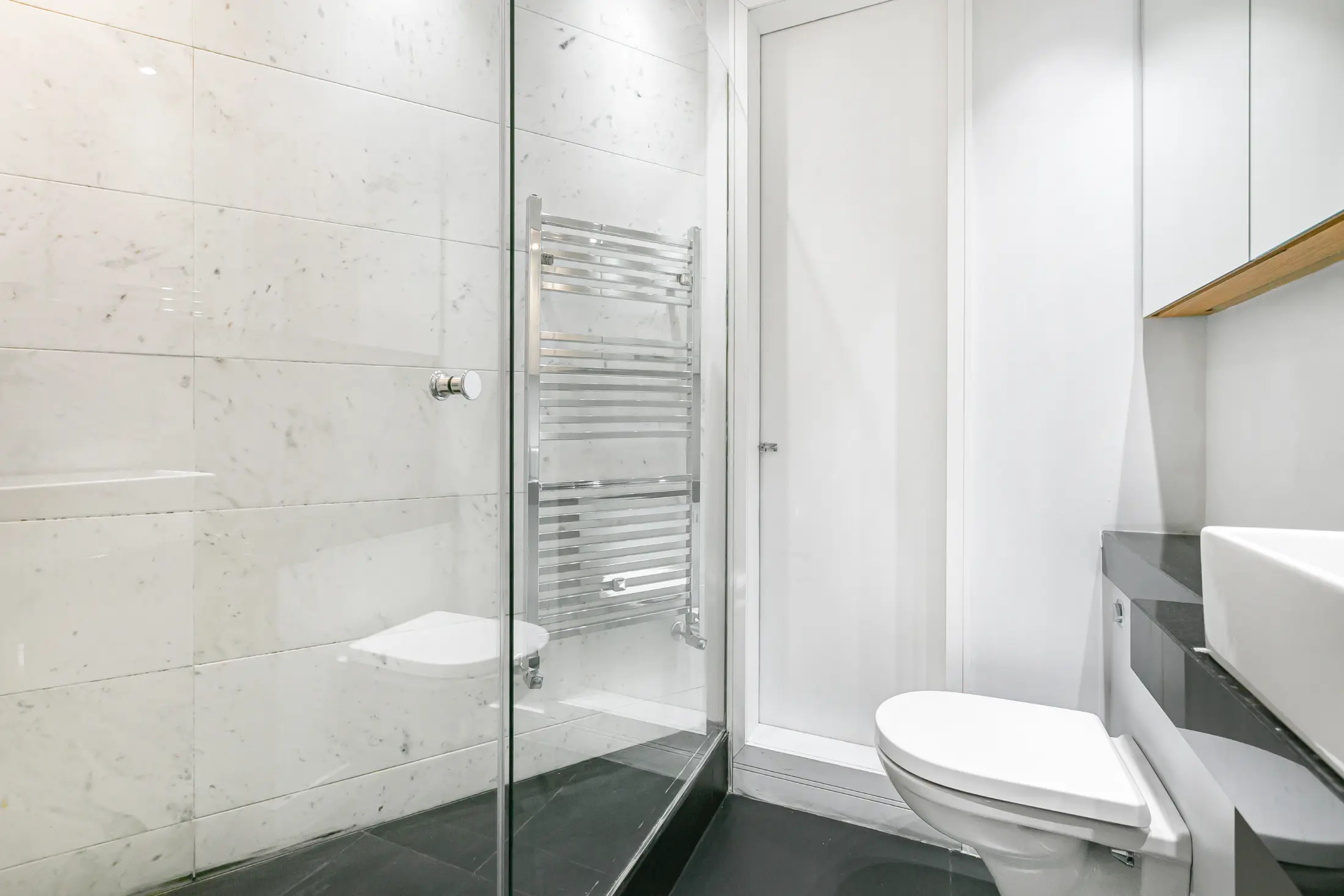Second view of the sleek bathroom at Casa Cribs with contemporary finishes and premium amenities.
