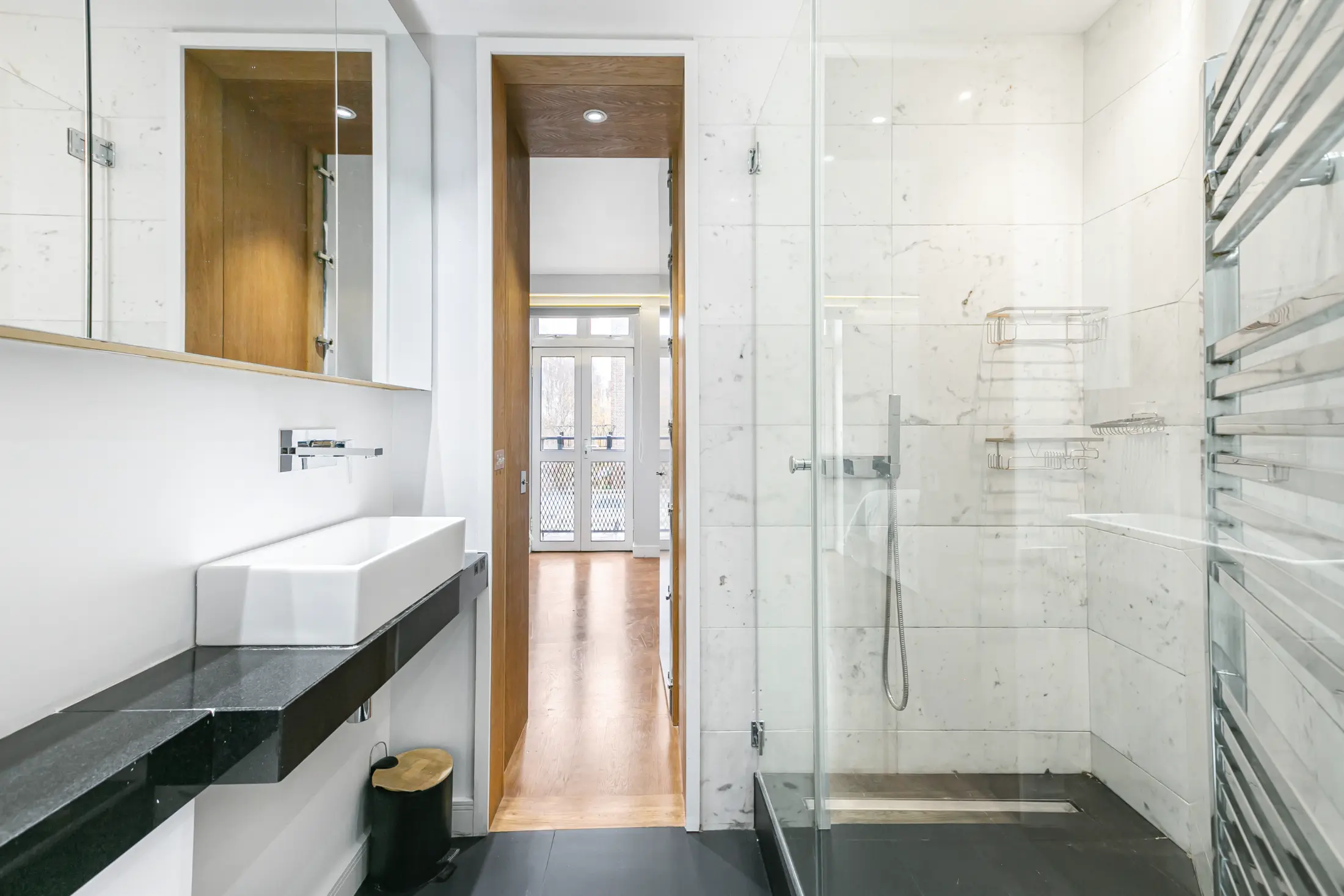 Third angle of the elegant bathroom at Casa Cribs with marble detailing and a spa-like feel.