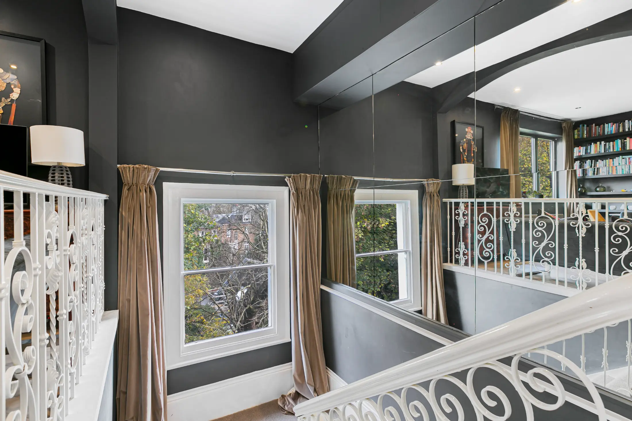 Charming balcony at Casa Cribs offering a peaceful spot to enjoy city views.