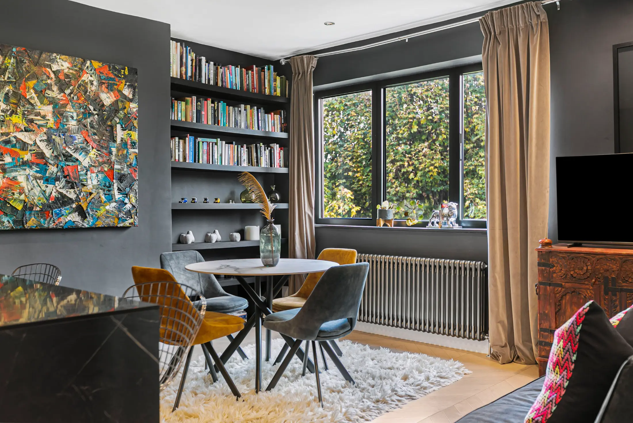 Fourth angle of the modern dining space at Casa Cribs blending comfort and style.