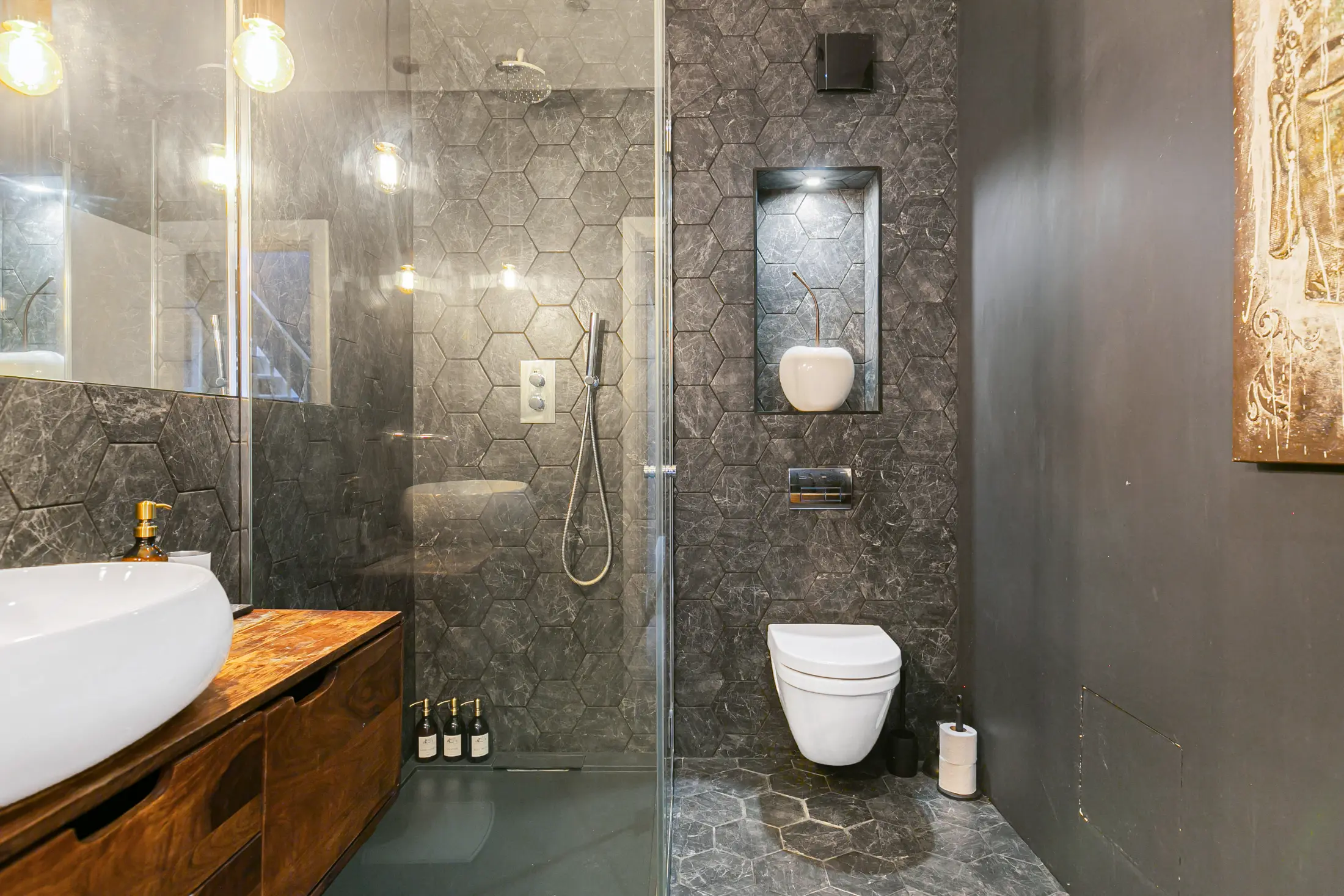 Another angle of the sleek bathroom at Casa Cribs with modern finishes and luxurious details.