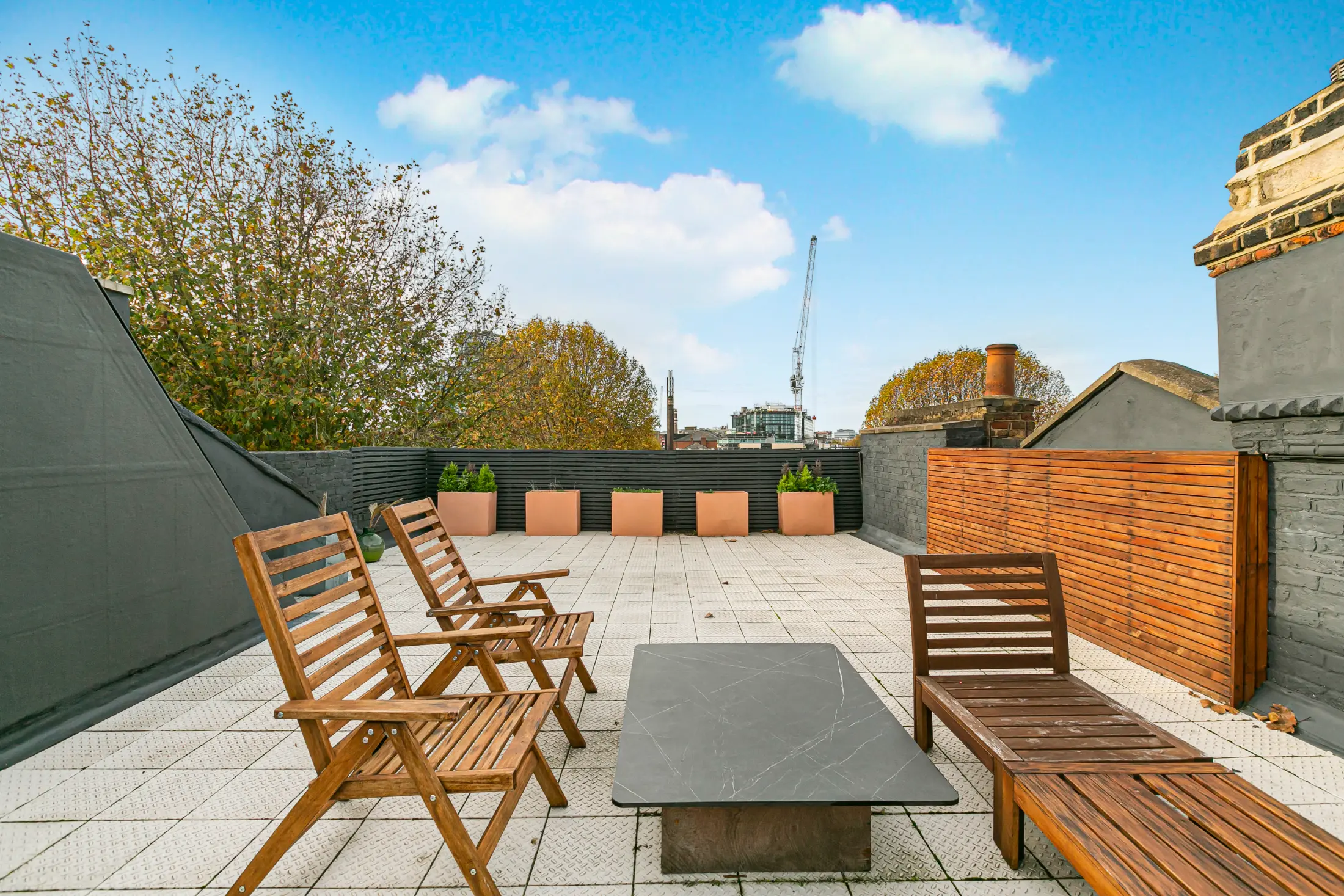 Expansive rooftop terrace at Casa Cribs perfect for al fresco dining and sunset views.