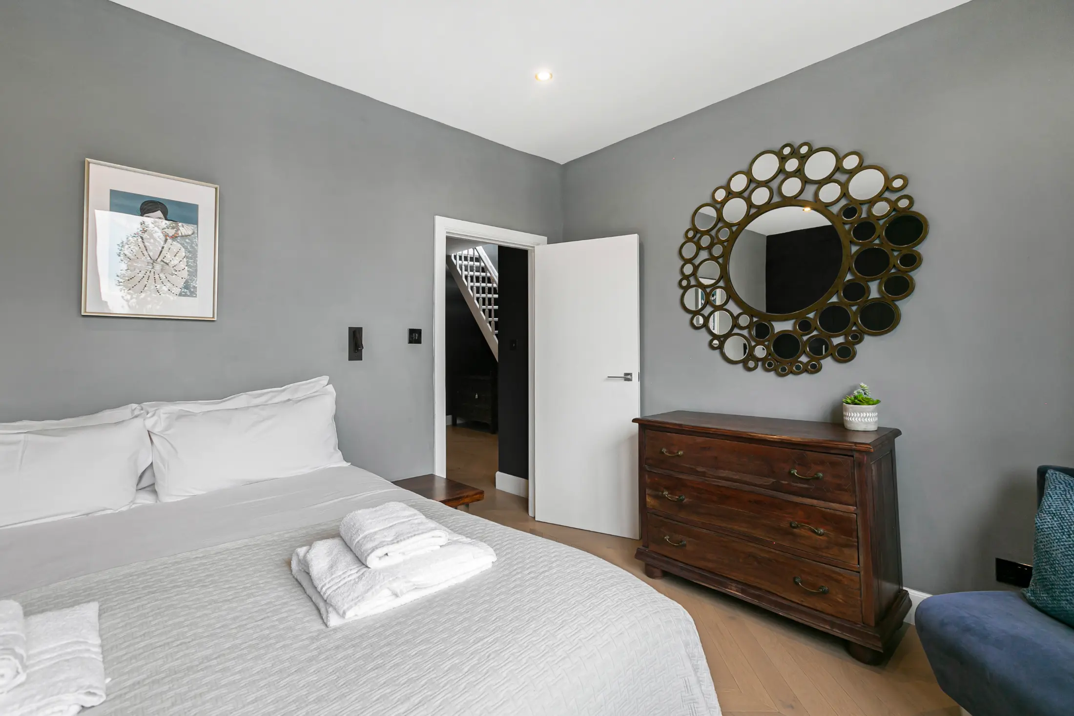 Second view of the bright bedroom at Casa Cribs offering a serene retreat and natural light.
