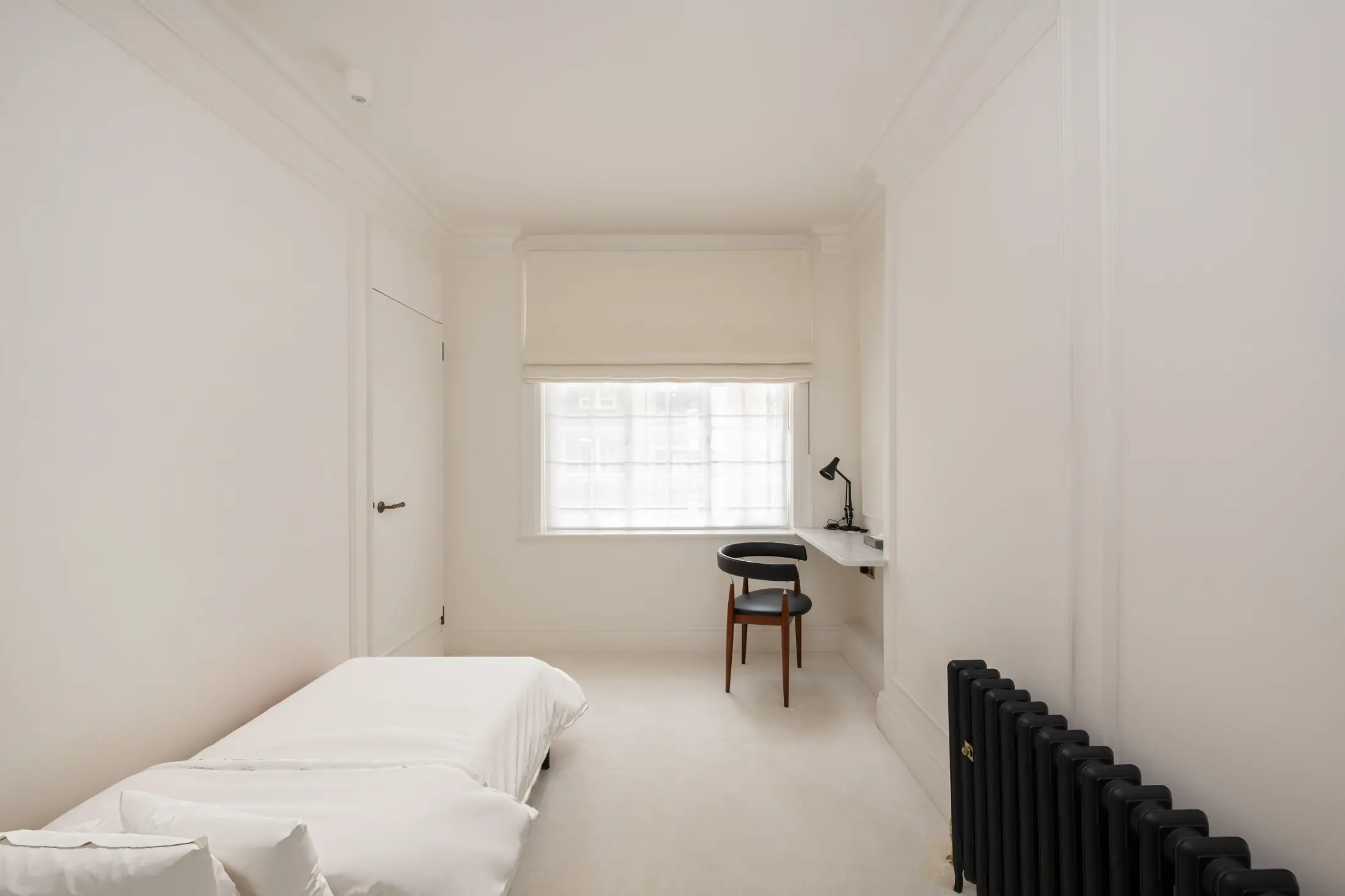 Fourth view of the comfortable bedroom at Casa Cribs showcasing natural light and refined finishes.