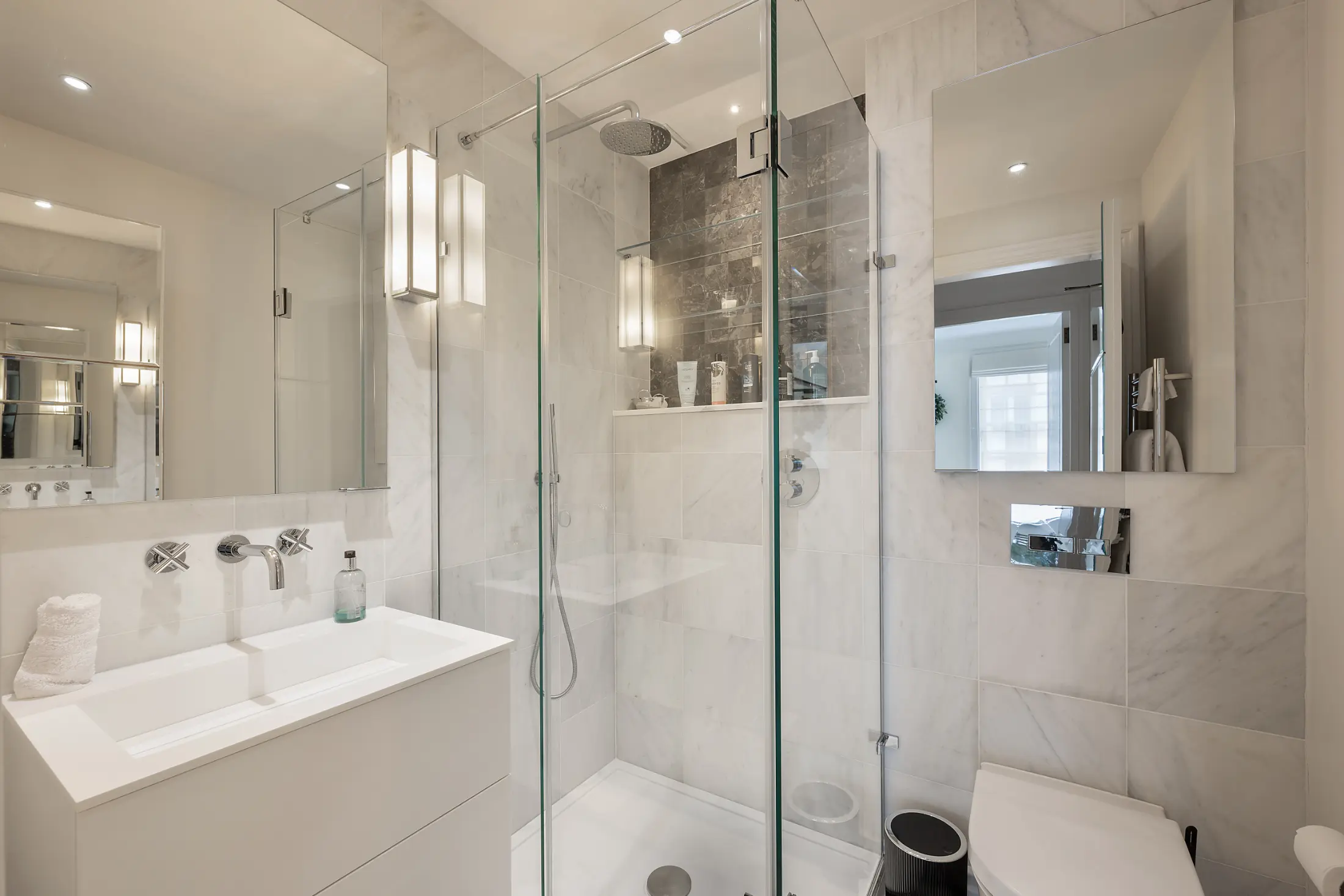 Sleek bathroom at Casa Cribs with contemporary finishes and refined elegance.