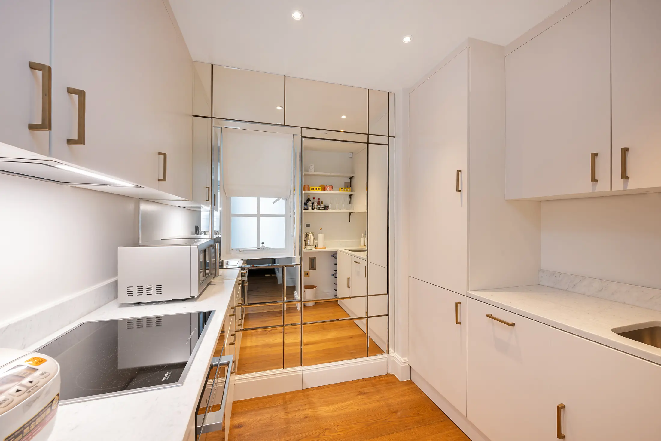 Fully equipped modern kitchen at Casa Cribs with high-end finishes and ample space.