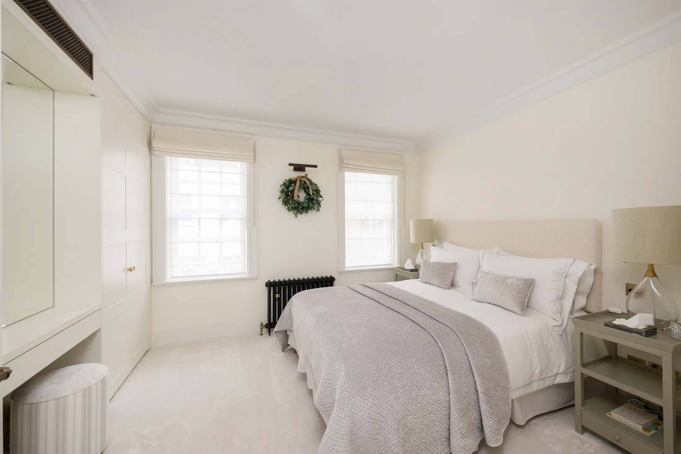 Cozy bedroom at Casa Cribs featuring plush bedding and natural light.
