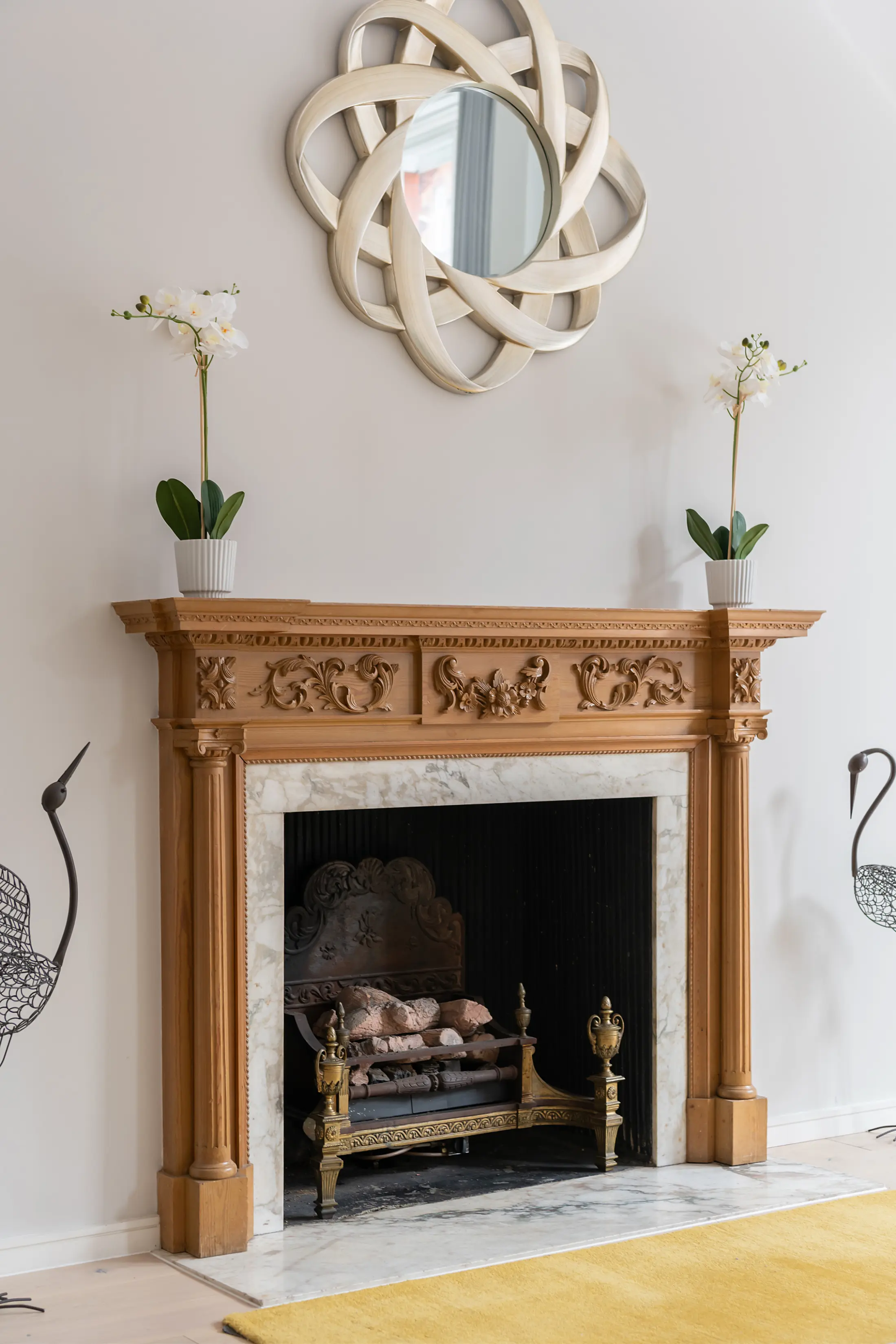 Decorative fireplace at Casa Cribs adding character and elegance to the living space.
