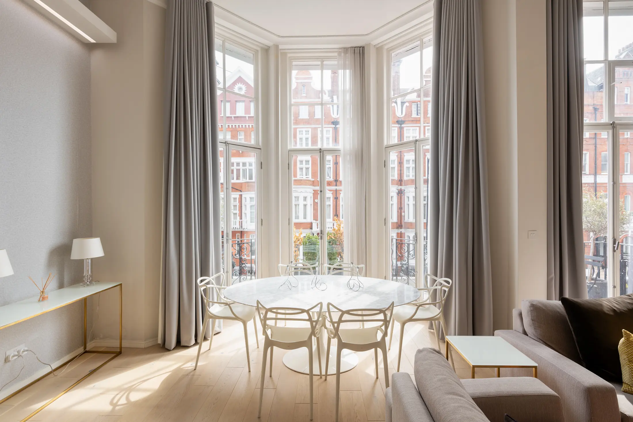 Refined dining table with chic chairs at Casa Cribs ideal for shared meals.