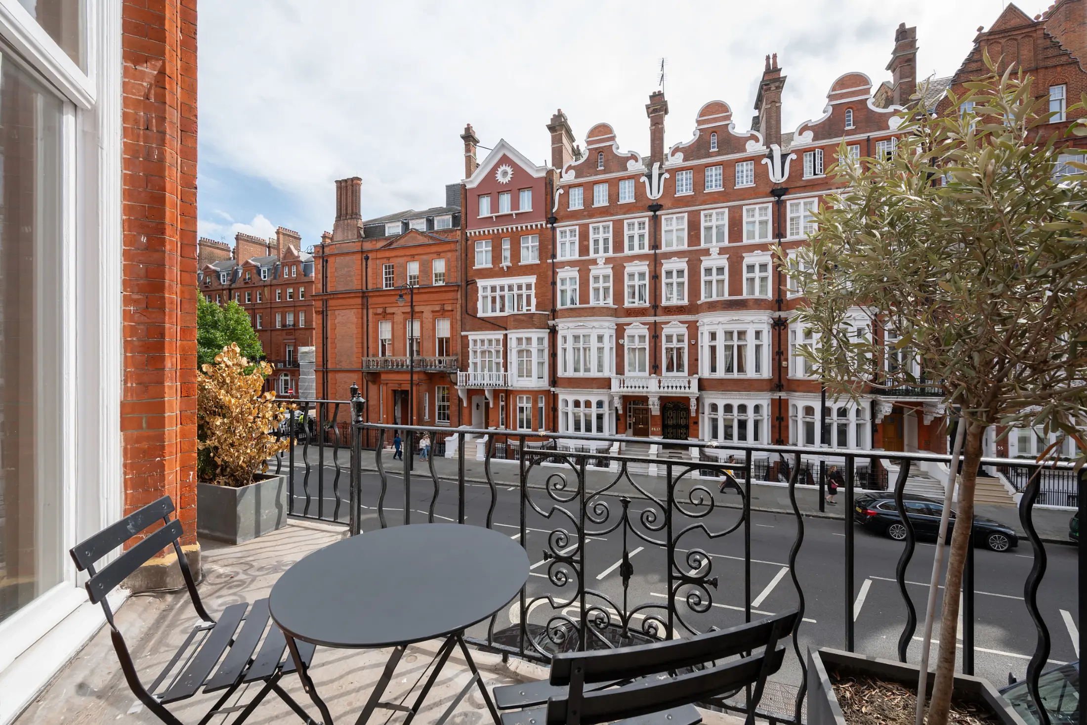 Private balcony at Casa Cribs offering charming London views and refined style.