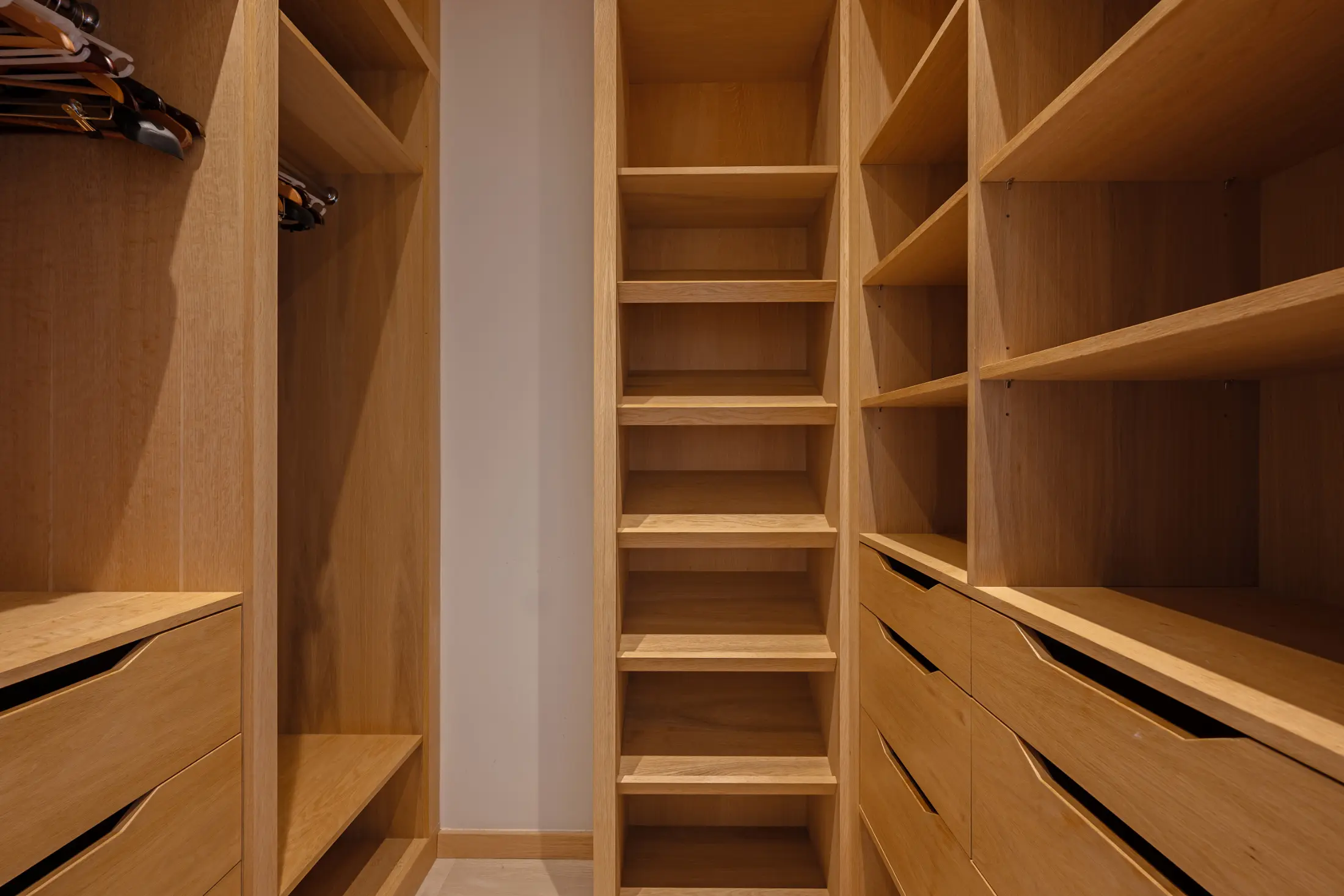 Spacious walk-in dressing room at Casa Cribs designed for elegant storage and luxury.