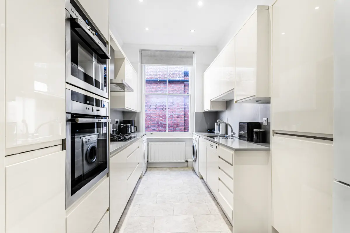 Fully equipped kitchen at Casa Cribs with sleek appliances and modern design.