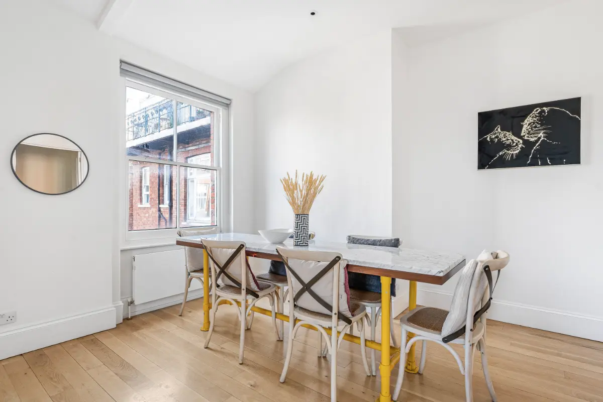 Dining space at Casa Cribs blending contemporary style with classic elegance.