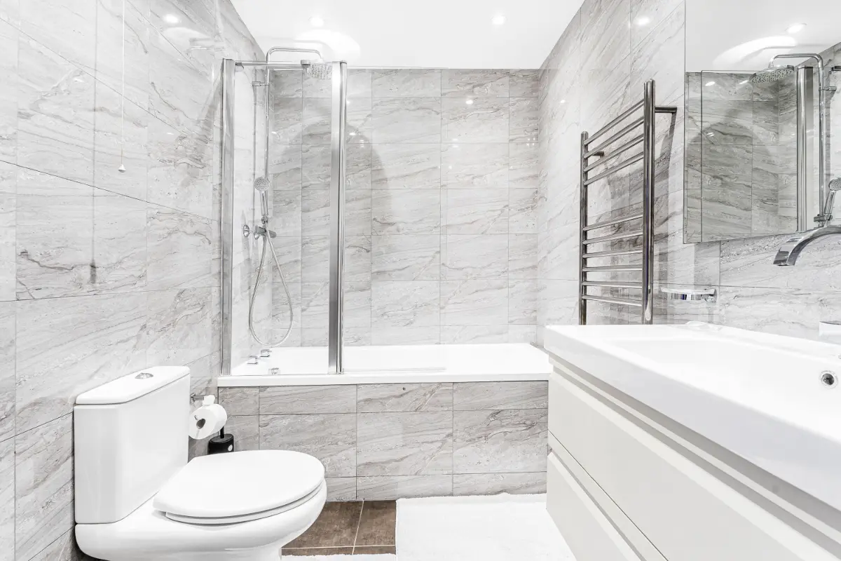 Bathroom at Casa Cribs with a marble bathtub and separate shower for a spa-like retreat.