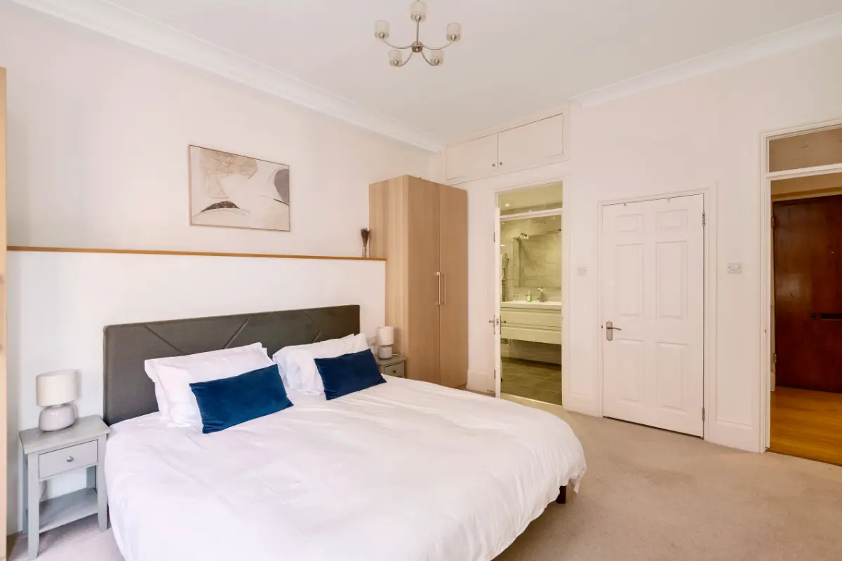 Another angle of the bedroom at Casa Cribs highlighting elegant furnishings and natural light.