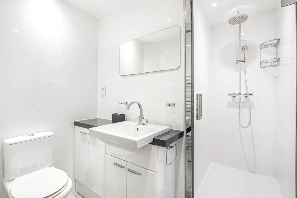 Another angle of the luxurious bathroom at Casa Cribs with marble details and high-end fixtures.
