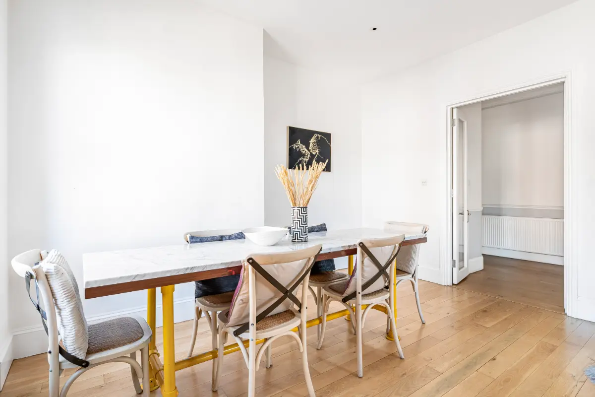 Dining table at Casa Cribs set for refined gatherings and elegant dining experiences.