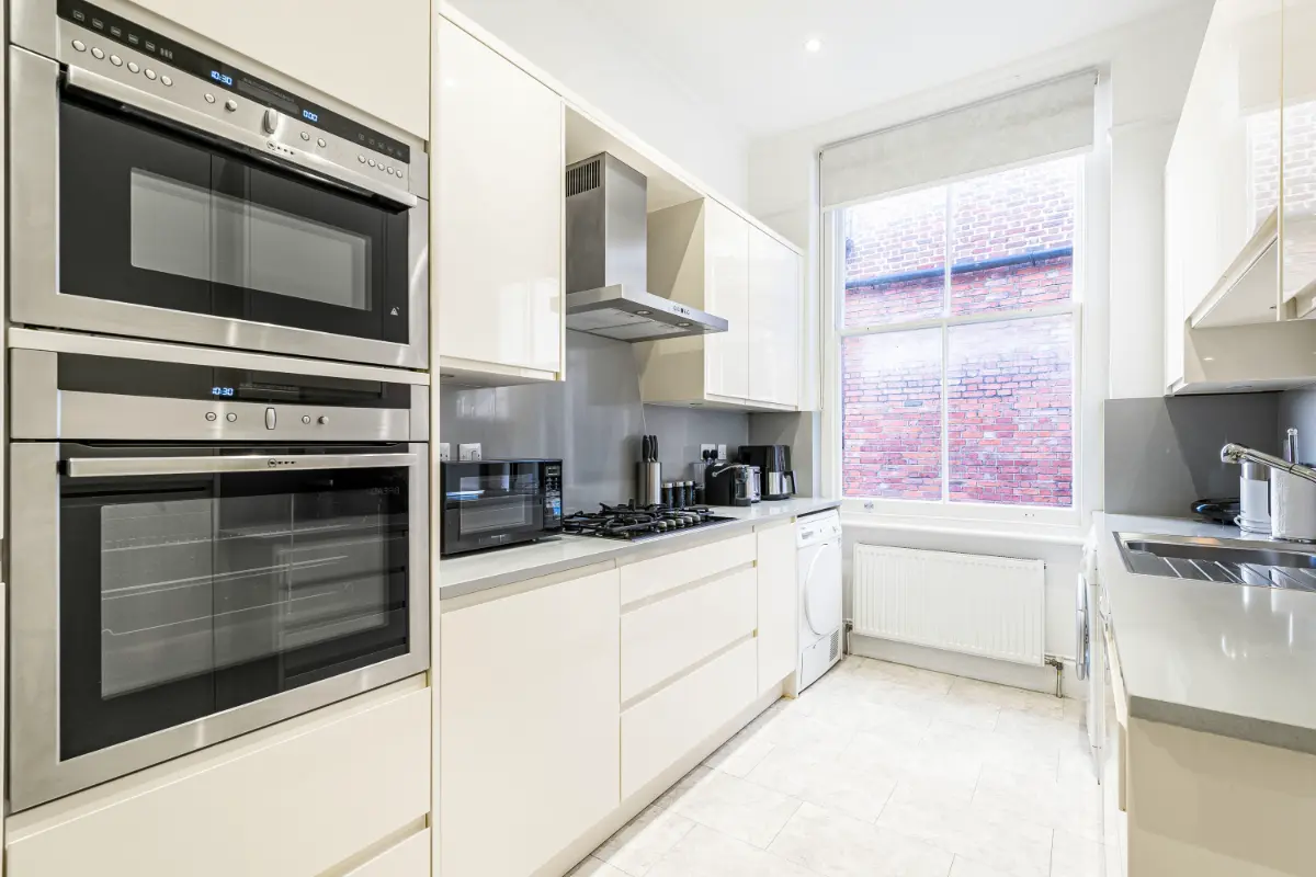 Spacious kitchen at Casa Cribs with modern appliances and ample storage.