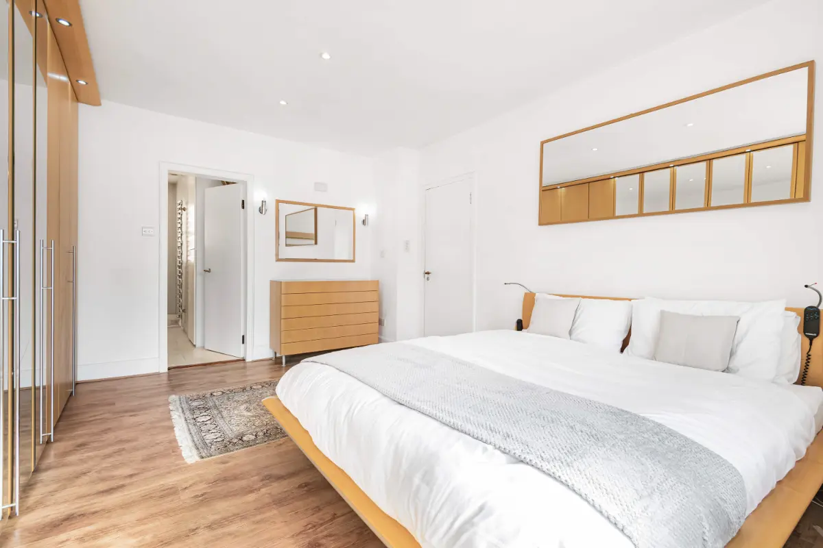 Spacious bedroom at Casa Cribs offering luxurious comfort and refined decor.