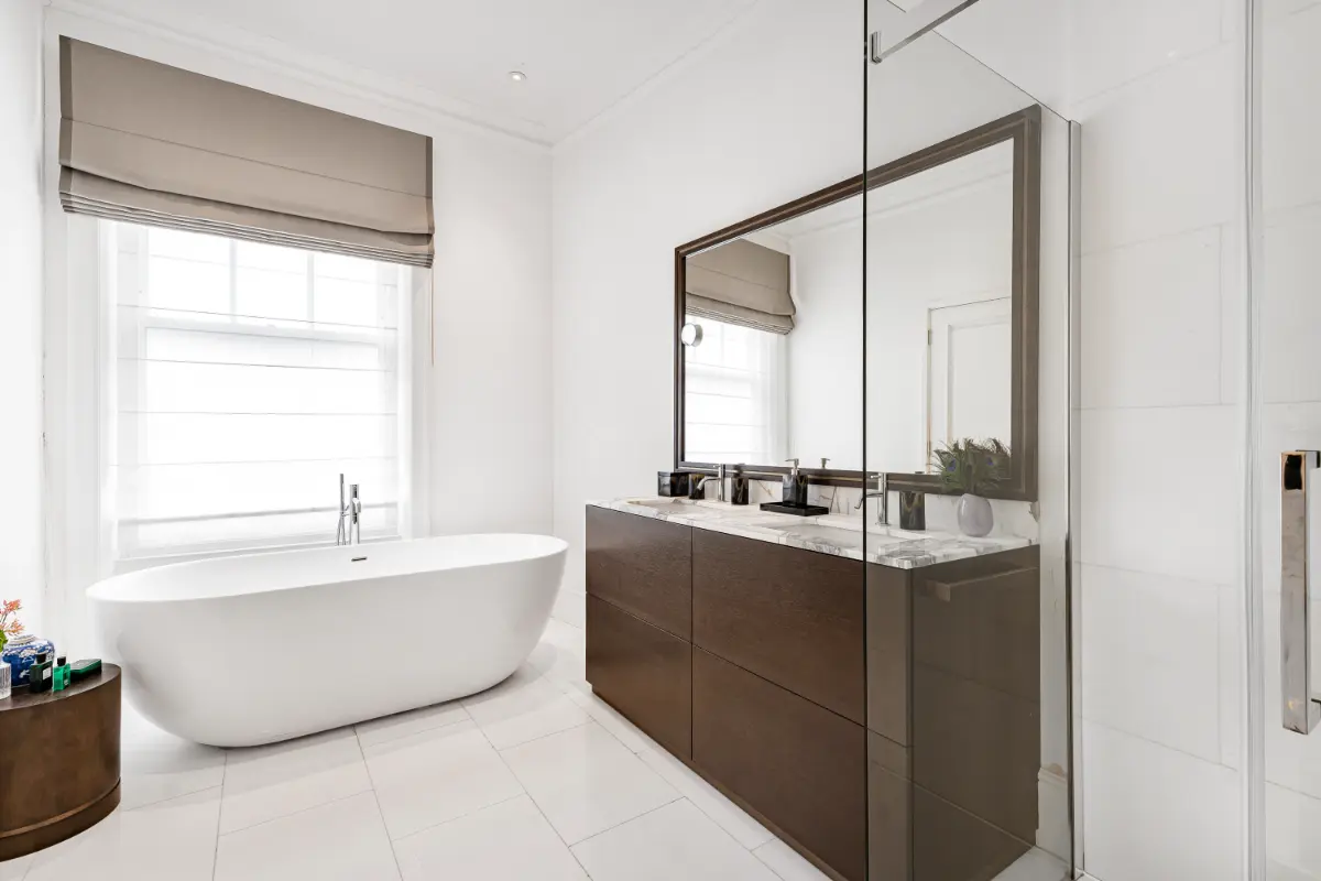 Luxurious bathroom at Casa Cribs featuring a marble bath for ultimate relaxation.