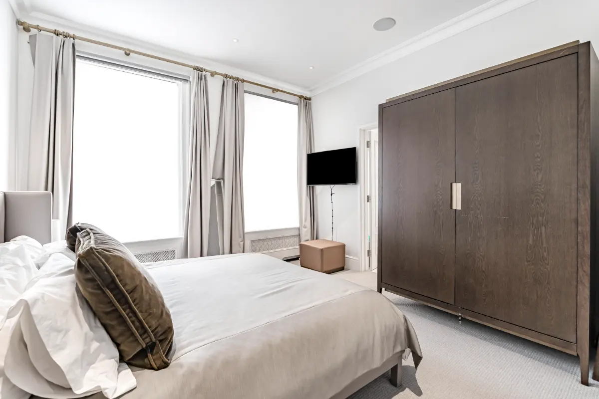 Another view of the serene bedroom at Casa Cribs featuring refined finishes and luxurious linens.