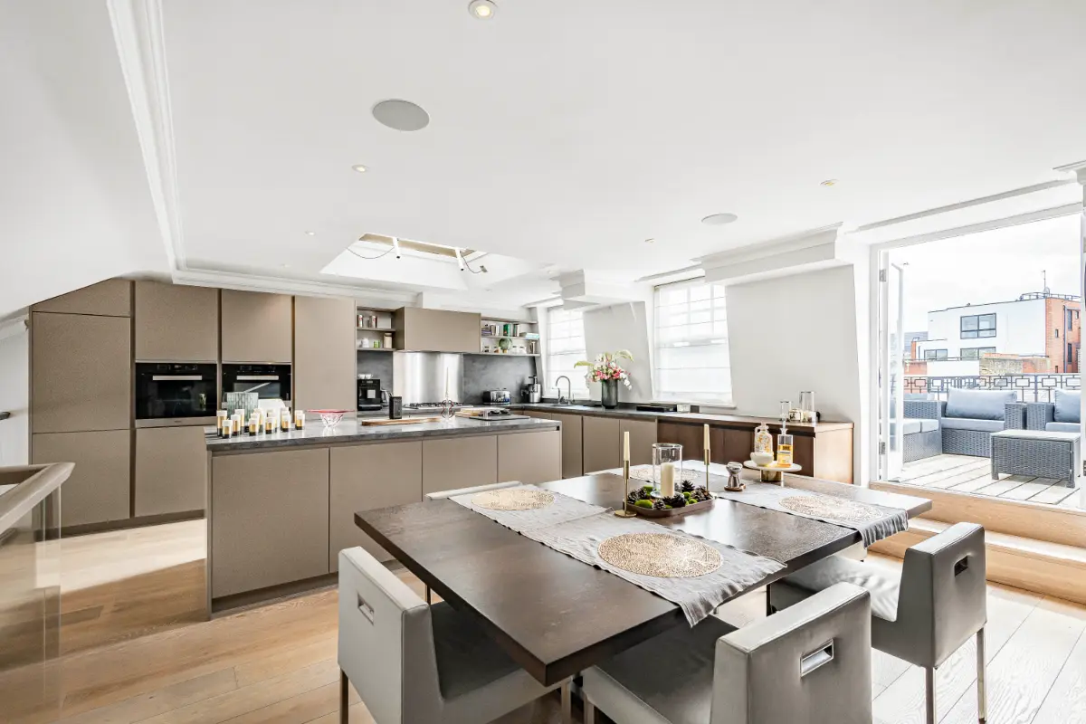 Spacious open-plan kitchen and dining area at Casa Cribs designed for entertaining.
