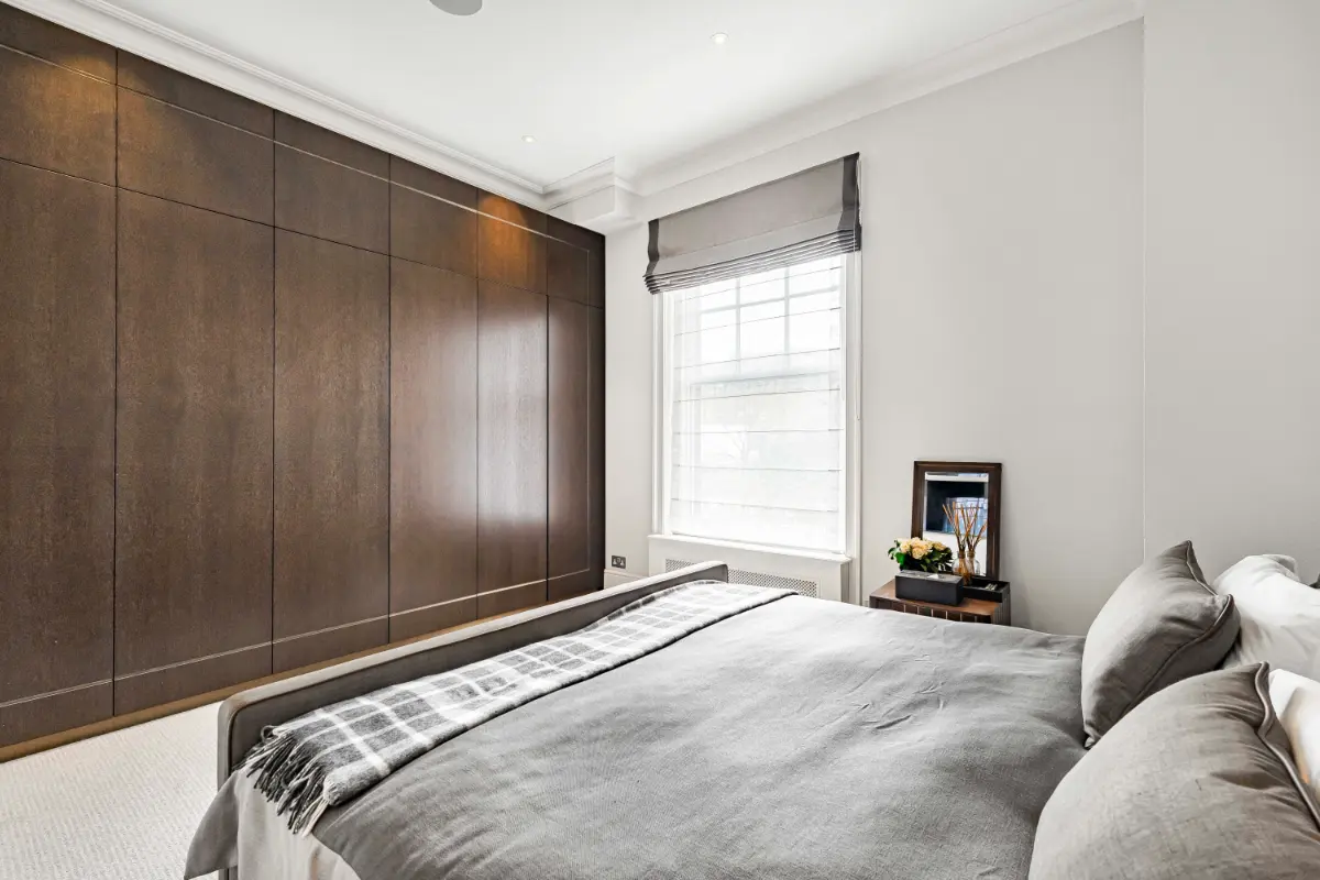 Additional bedroom at Casa Cribs with sophisticated design and plush bedding.