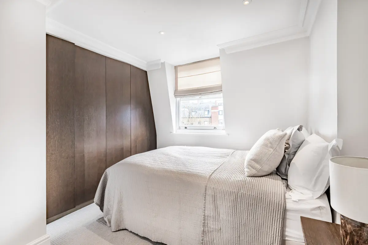Serene bedroom at Casa Cribs with plush bedding and natural light.