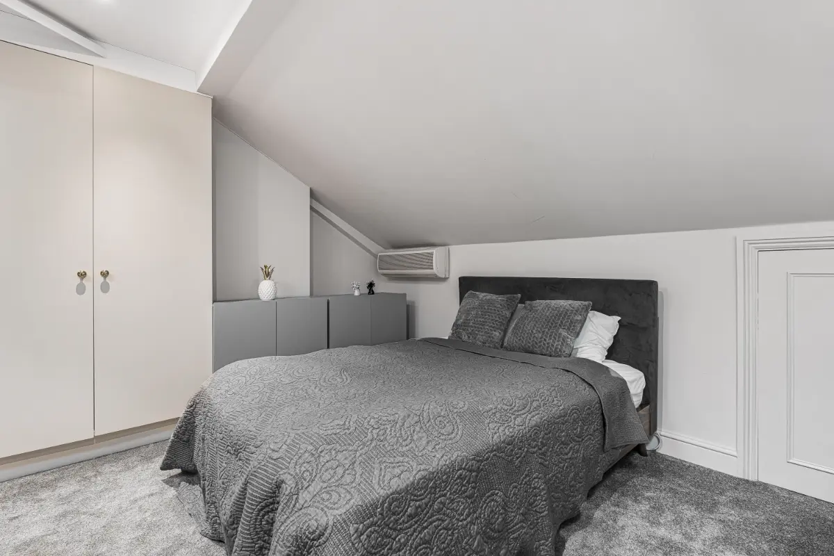 Second view of the elegant bedroom at Casa Cribs showcasing natural light and refined details.