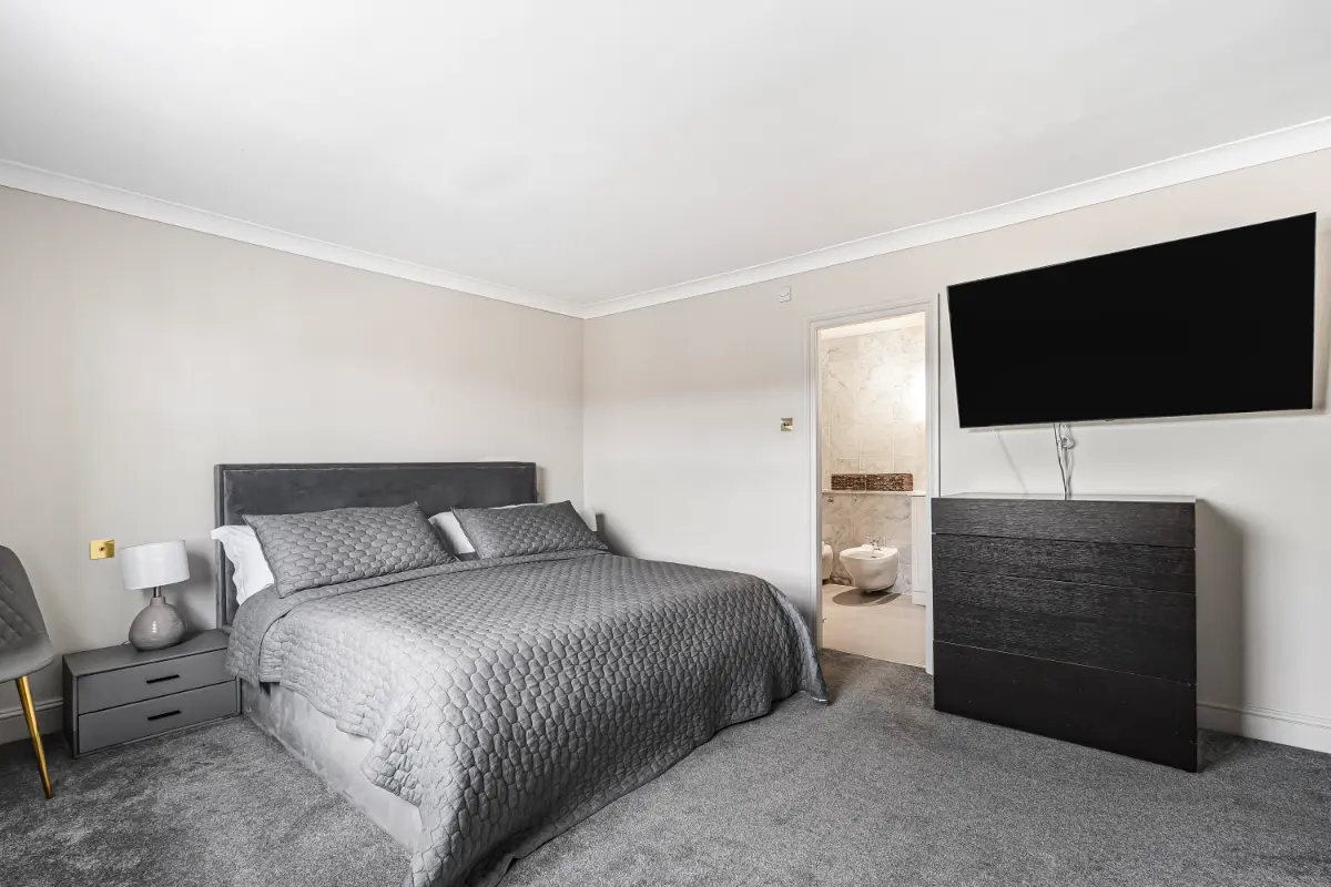 Another bedroom at Casa Cribs offering cozy luxury and serene comfort.