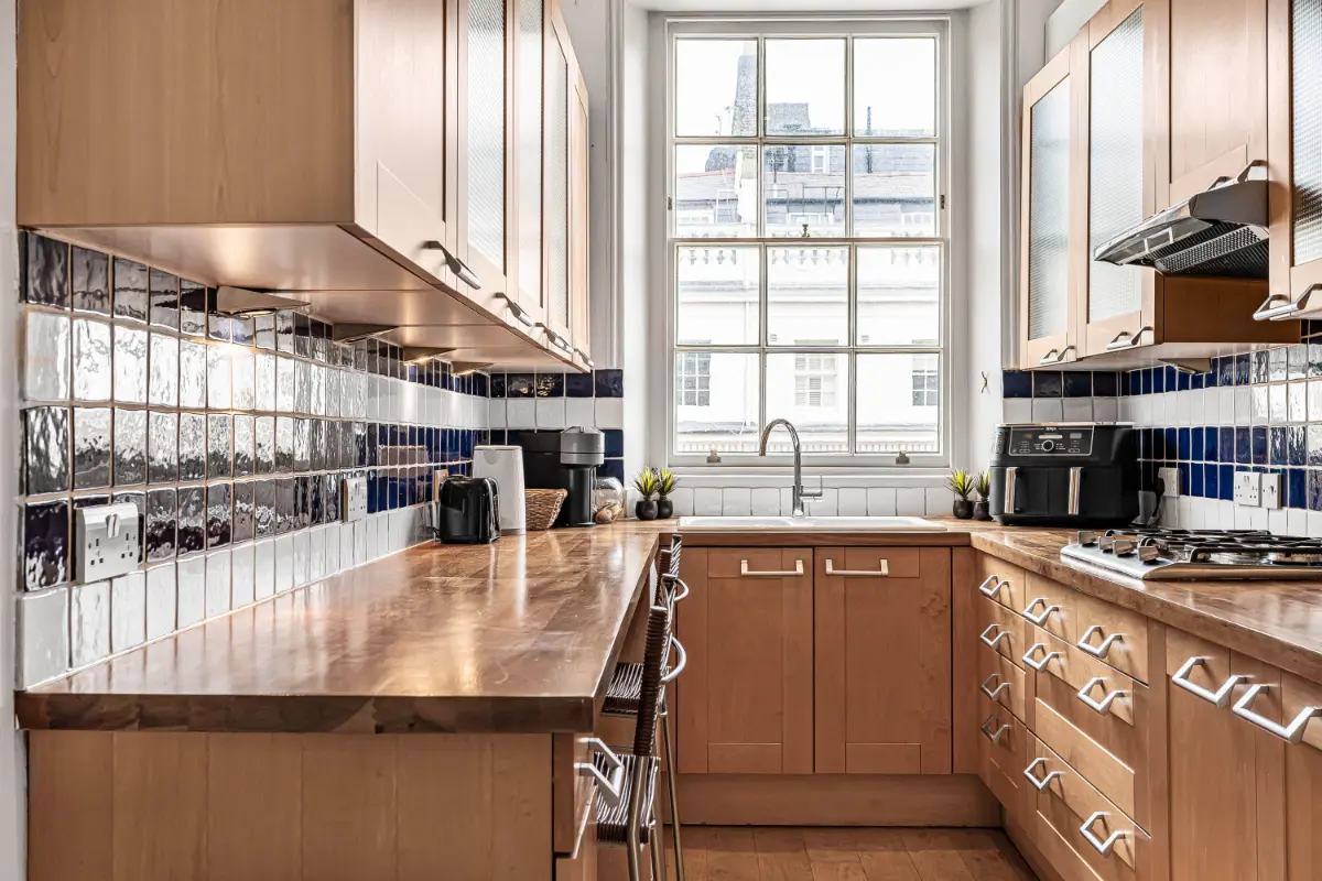 Chef’s kitchen at Casa Cribs with high-end appliances and a sleek layout.